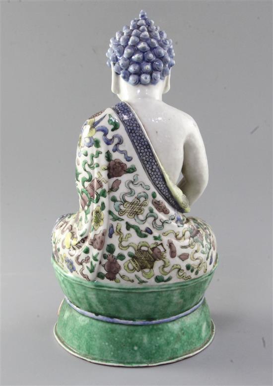 A Chinese enamelled porcelain seated figure of Buddha Shakyamuni, late 19th century, height 29.5cm